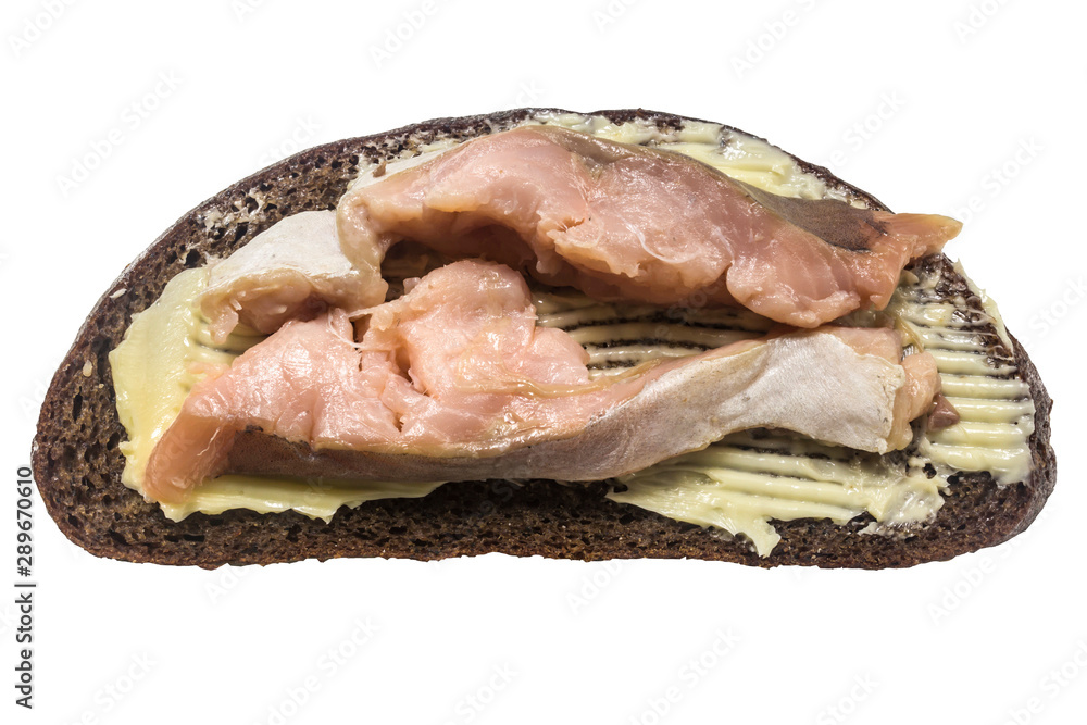 Fish sandwich. Two slices of salted pink salmon, the edge of a rye loaf and butter. Close up. Lighting on the right. A site about cuisine and cookery. Fish sandwich. Two slices of salted pink salmon, the edge of a rye loaf and butter. Close up. Lighting on the right. A site about cuisine and cookery.