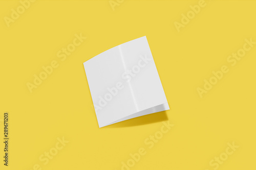 Mockup square booklet, brochure, invitation isolated on a yellow background with soft cover and realistic shadow. 3D rendering.