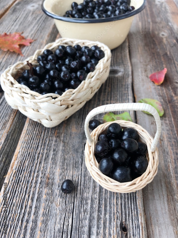 Fresh chokeberry on a wooden table view Fresh chokeberry on a wooden table view