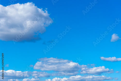 Light cloud in the bright blue sky on a sunny summer day