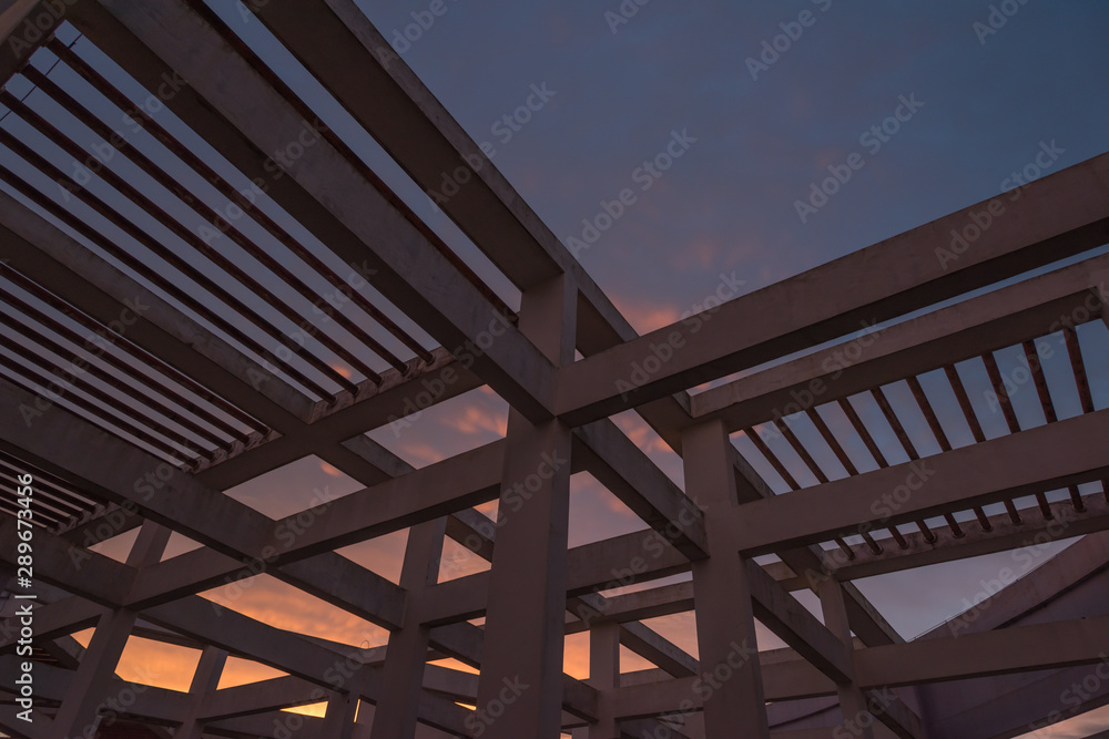 Concrete beam net on the roof of a high-rise building in the twilight twilight