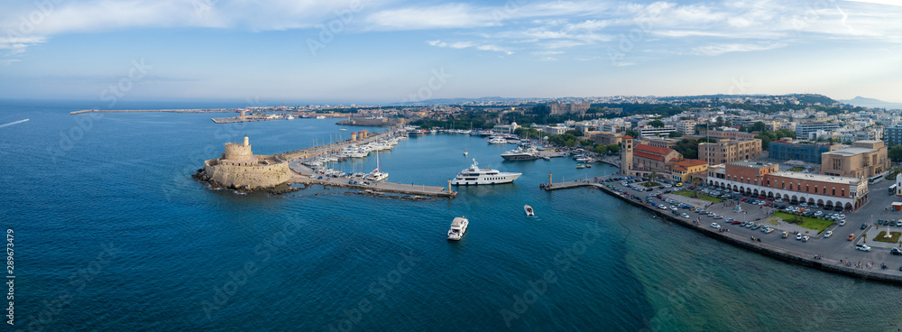Aeria view of Rhodes city, Dodecanese, Greece. Panorama with Mandraki port, lagoon and clear blue water. Famous tourist destination in Europe