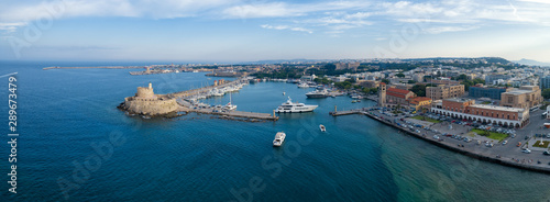 Aeria view of Rhodes city, Dodecanese, Greece. Panorama with Mandraki port, lagoon and clear blue water. Famous tourist destination in Europe