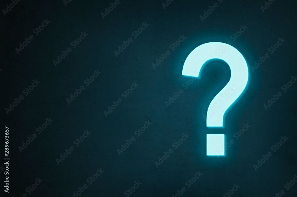 Neon question mark glows on a dark background, the concept of finding the answer to a question or finding a solution. Neon question mark glows on a dark background, the concept of finding the answer to a question or finding a solution.