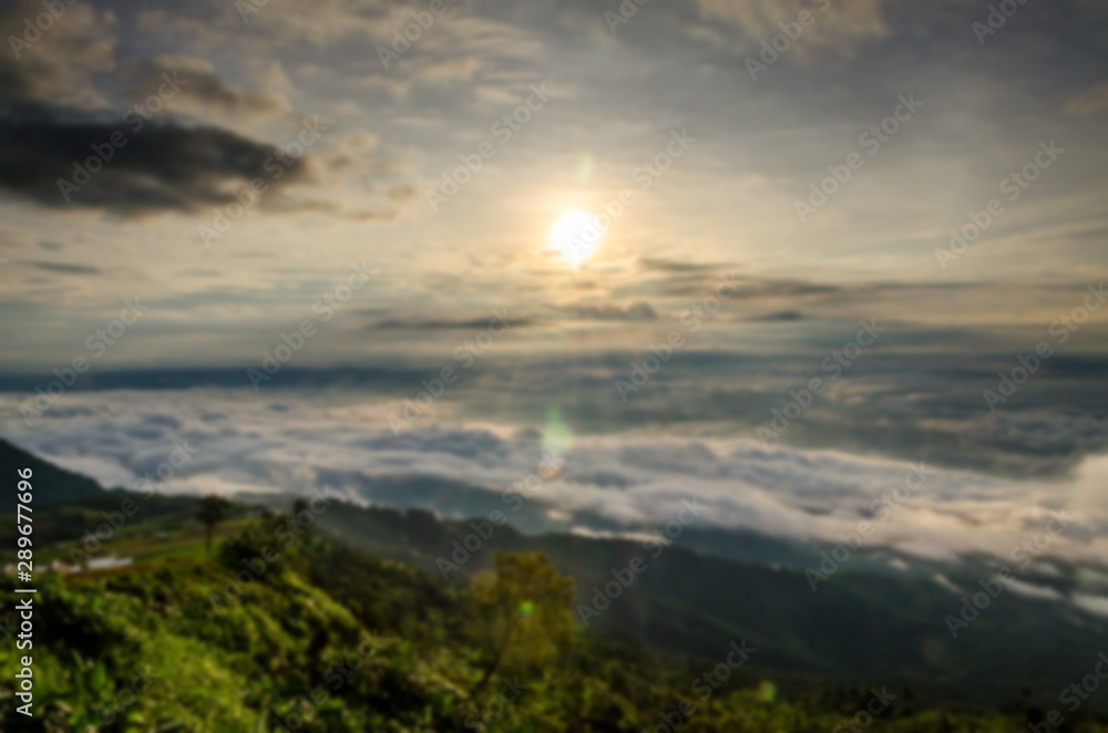 Picture blurred of beautiful landscape view point of sea of clouds on a hills at sunrise scene at phu tubberk , petchabun