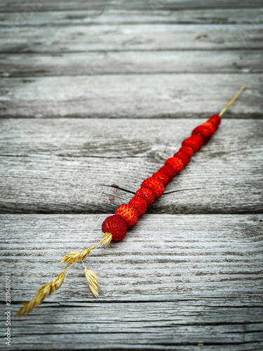 Wild strawberries on a stra...