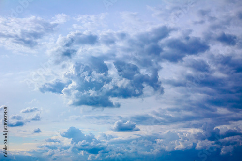 Fototapeta Naklejka Na Ścianę i Meble -  Blue sky with cumulus clouds before the storm