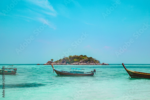 Traditional Thai boats moored in a sheltered bay