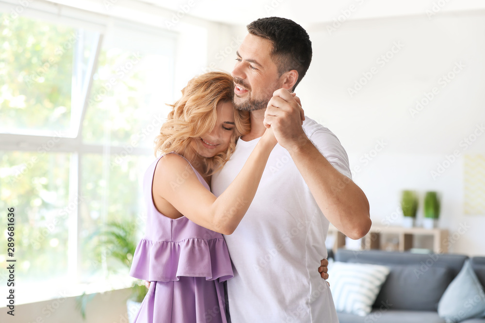 Happy dancing couple at home Happy dancing couple at home