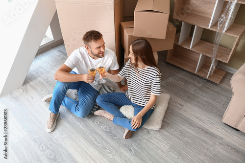 Happy young couple drinking...