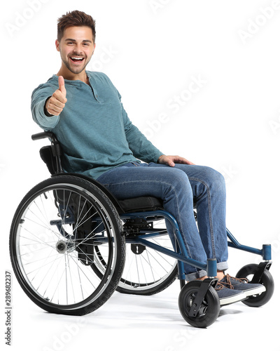 Happy man in wheelchair sho...