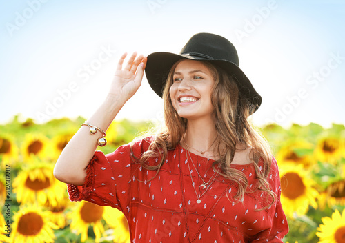 Beautiful young woman in su...