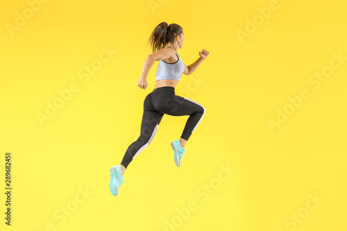 Running sporty woman on col...