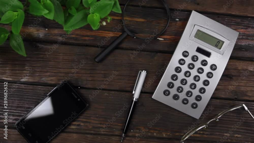 Work space, office wooden table. Crane shot. View from above.