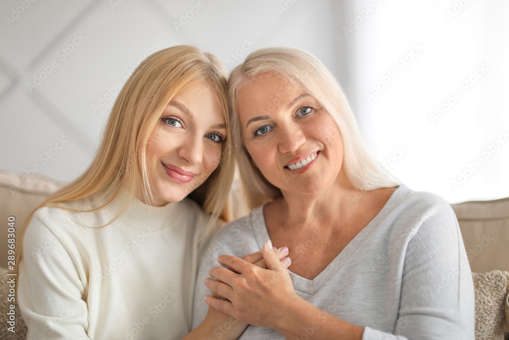 Portrait of beautiful mother and daughter at home Portrait of beautiful mother and daughter at home