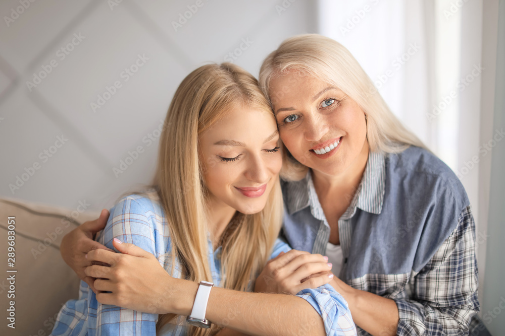 Portrait of beautiful mother and daughter at home Portrait of beautiful mother and daughter at home