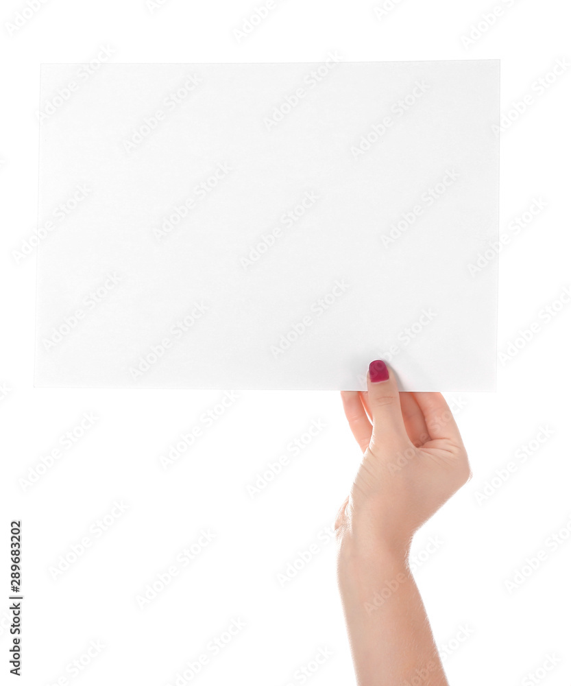 Obraz premium Female hand with empty sheet of paper on white background
