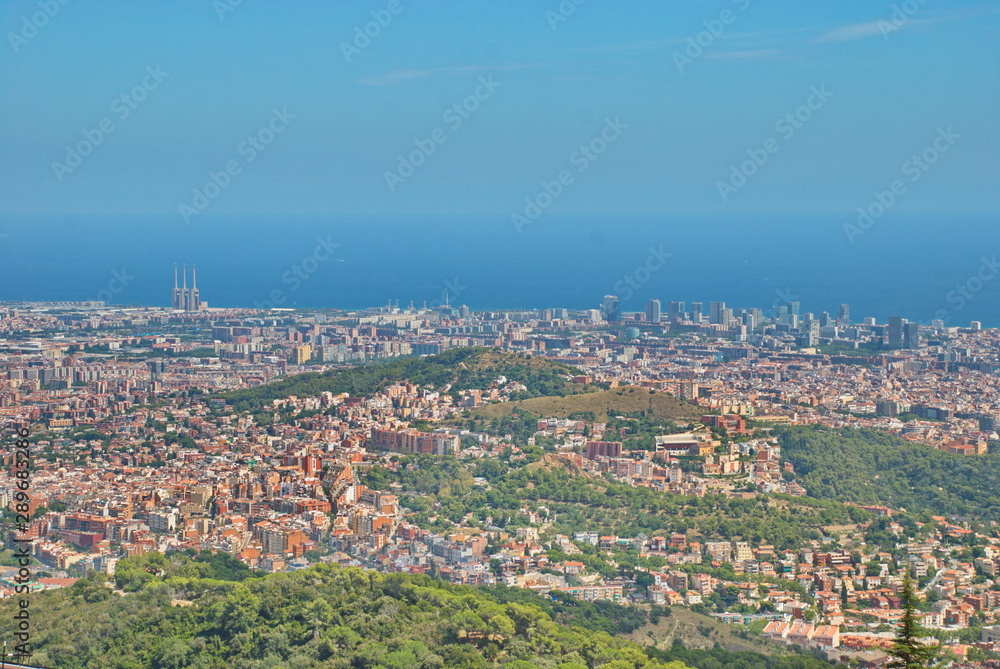 Amazing beautiful view from Mount Tibidabo to Barcelona and the Sea