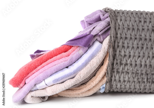 Basket with laundry on white background