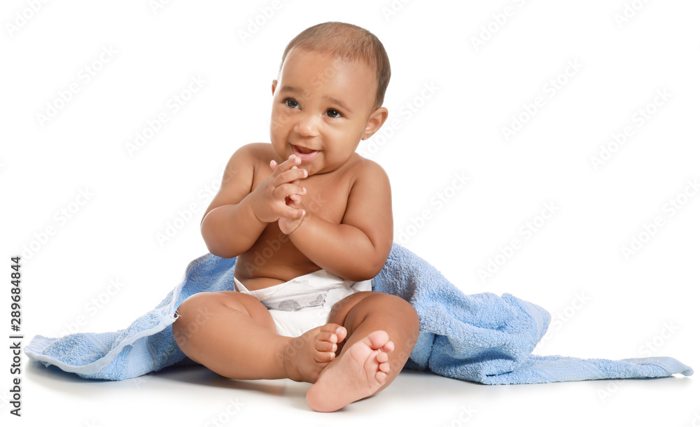Cute African-American baby with soft towel on white background Cute African-American baby with soft towel on white background