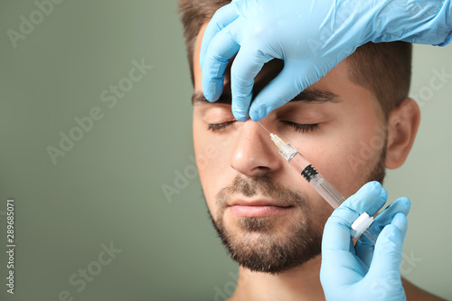 Handsome man receiving fill...