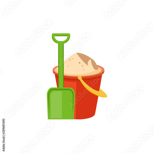 Red plastic bucket filled with sand and green scoop shovel