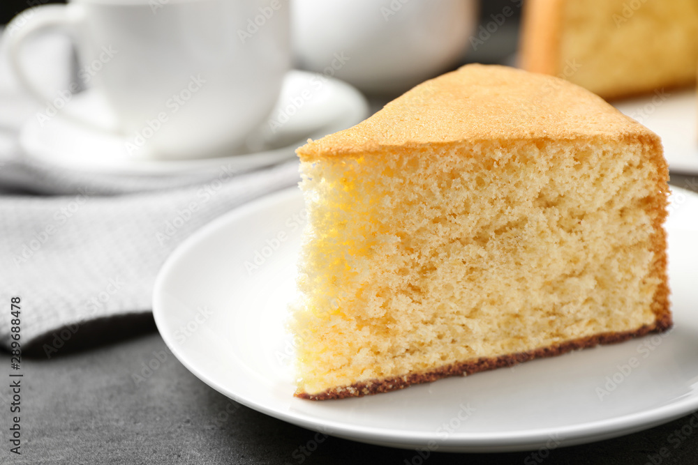 Piece of delicious fresh homemade cake on grey marble table Piece of delicious fresh homemade cake on grey marble table