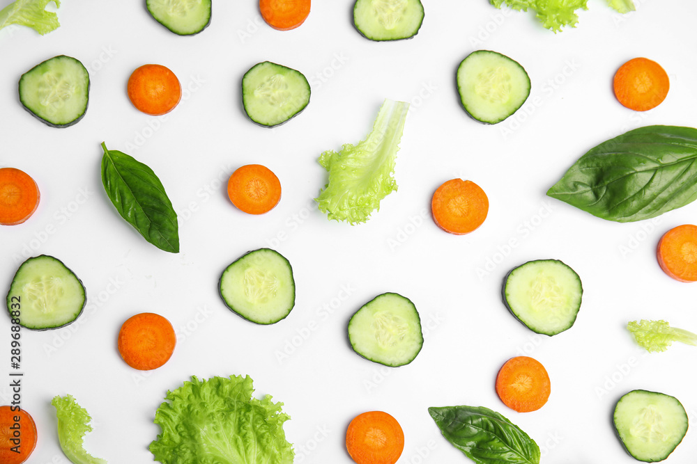 Fresh vegetables for salad on white background, top view Fresh vegetables for salad on white background, top view