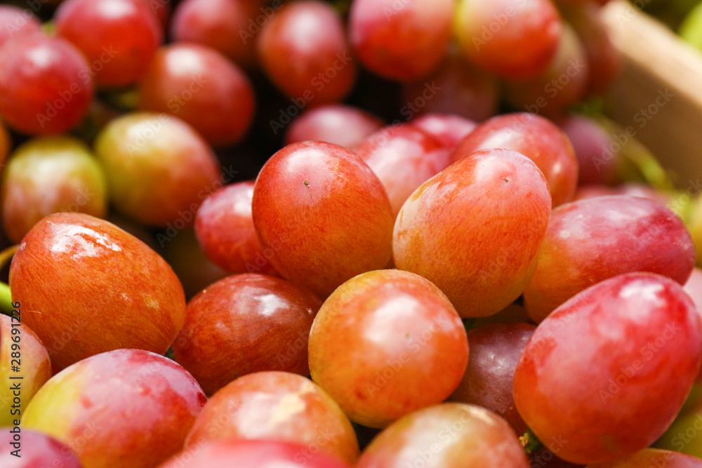 Fresh ripe juicy red grapes as background, closeup view Fresh ripe juicy red grapes as background, closeup view