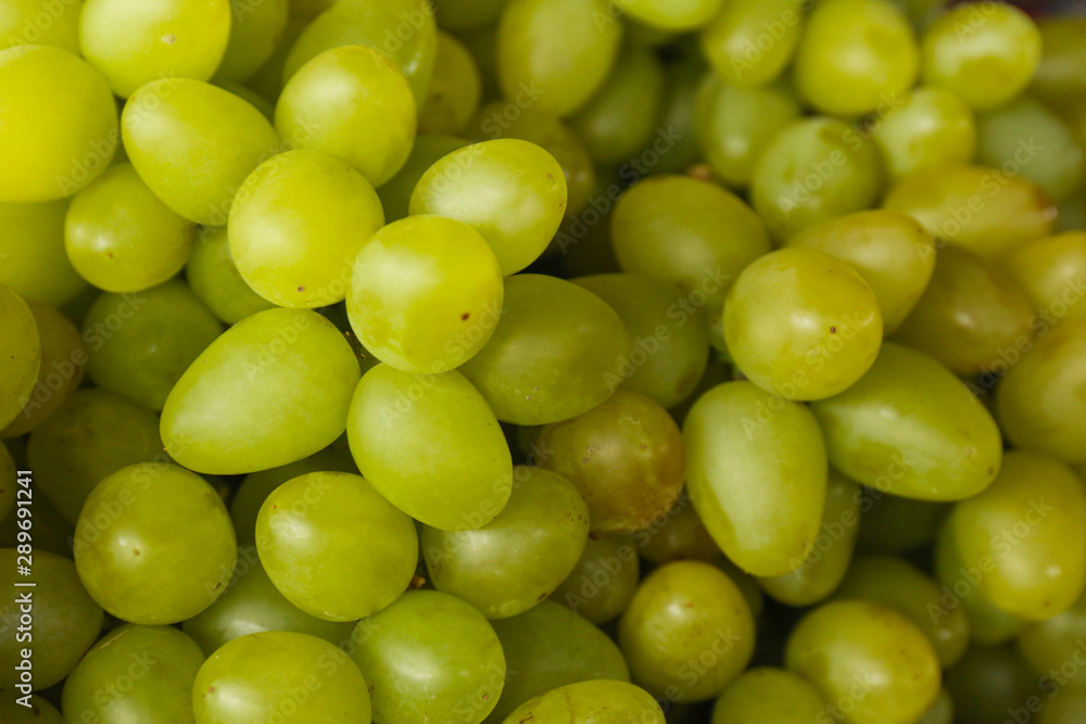 Fresh ripe juicy white grapes as background, closeup view Fresh ripe juicy white grapes as background, closeup view