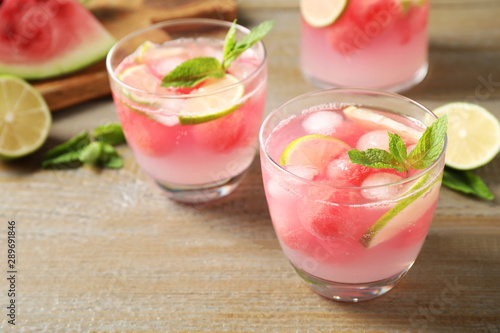Tasty refreshing watermelon drink on wooden table