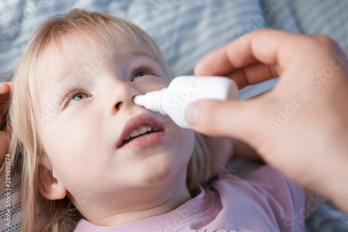 cold spray for the baby. the child caught a cold. treatment of children's runny nose