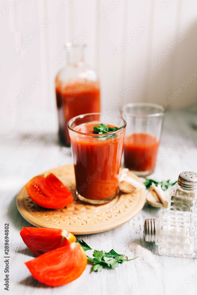 Glass of tomato juice on on a light background Closeup Top view