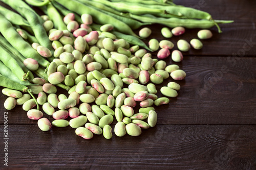 pods of beans and legumes grain closeup. background with raw beans.