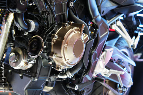 Selective focused on a high performance motorcycle engine. The engine is installed on a designed motorcycle chassis.   photo