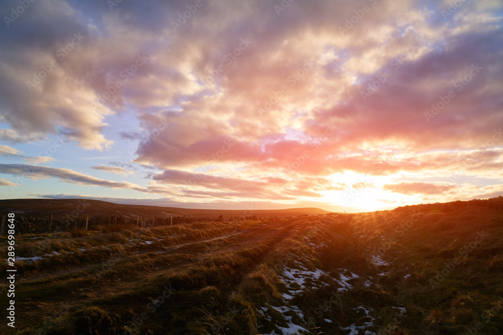 A dramatic red sky sunset over Bolt's Law in County Durham.