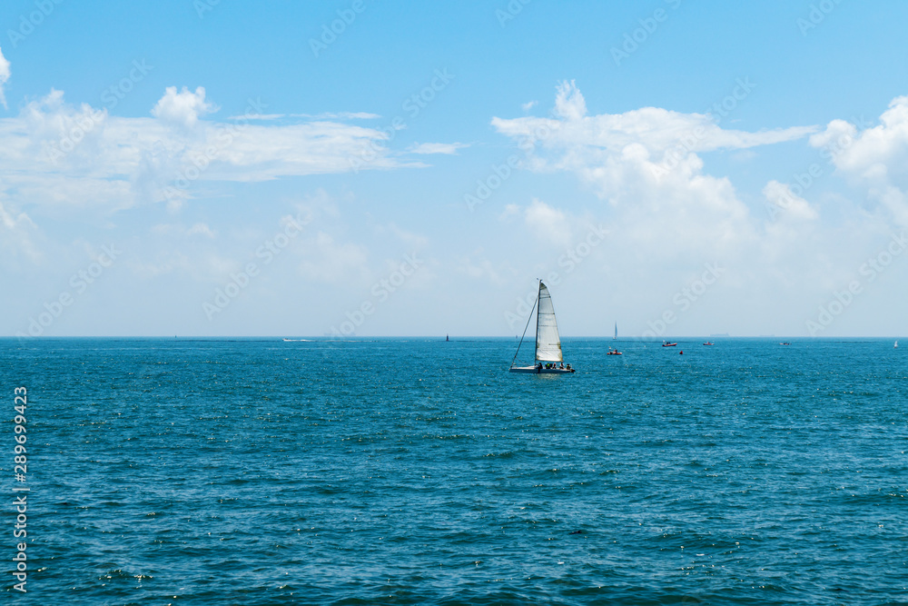 a sailboat drifting on the sea
