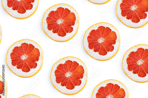 Fototapeta Naklejka Na Ścianę i Meble -  Fresh bright round grapefruit slices. Flat lay, top view, bright design. Fruit composition. The concept of vitamin C, healthy healthy food.