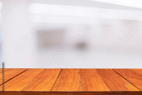 Wood table top on blur hall background © pushish images