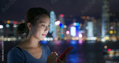 Photography Woman use of cellphone in city