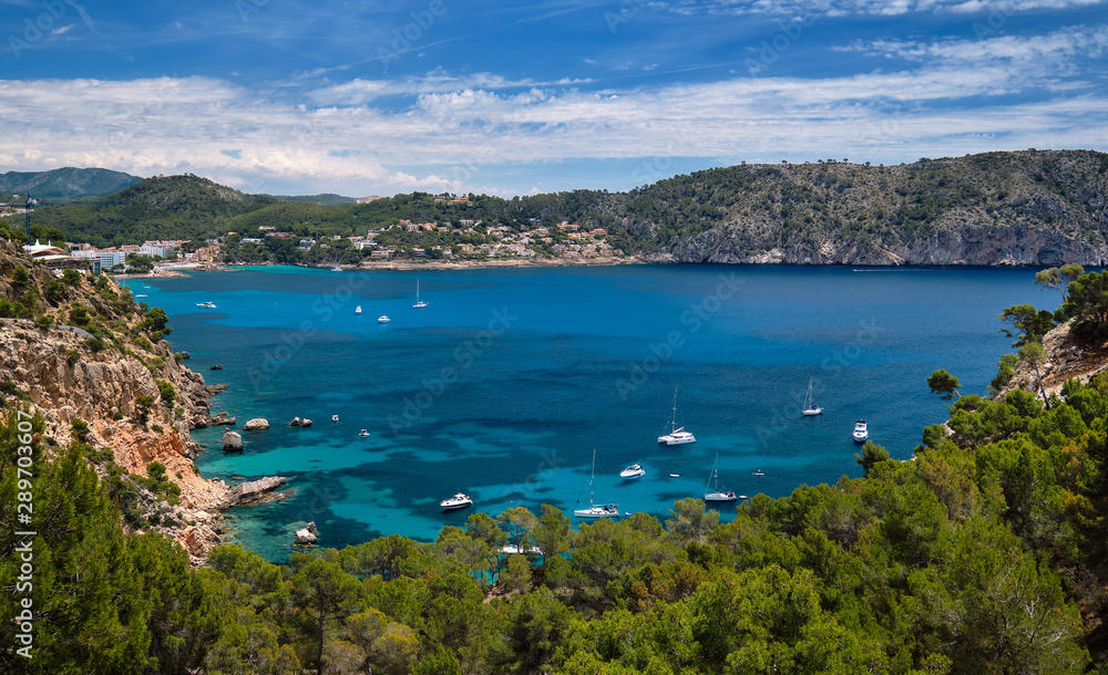 Bay with luxury yachts rocky mountains of Cala Blanca Andratx, Mallorca, Spain