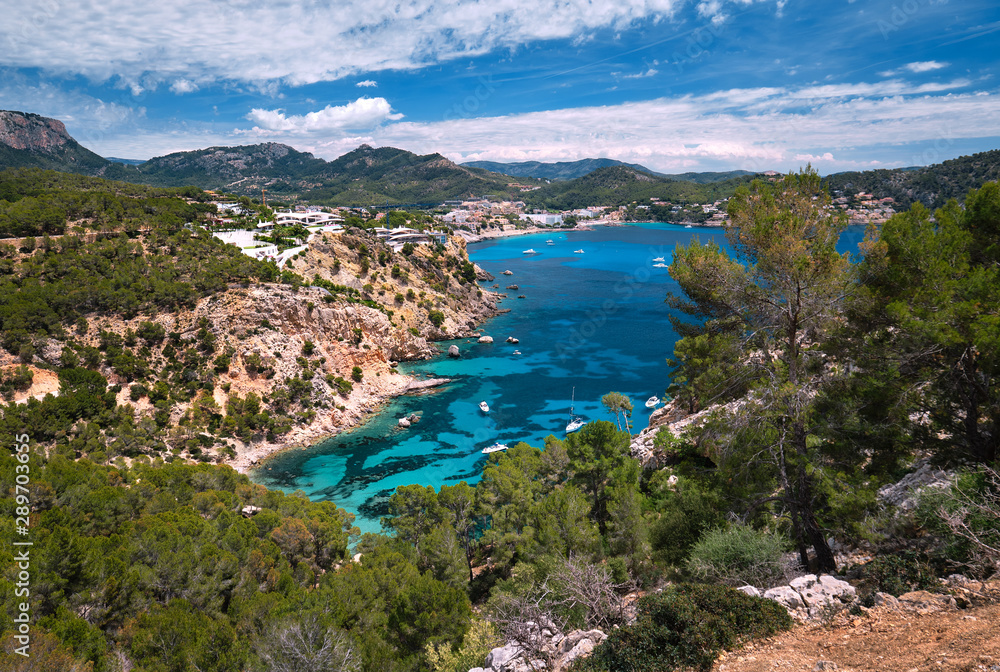 Panorama of bay with luxury yachts rocky mountains of Cala Blanca Andratx, Mallorca, Spain