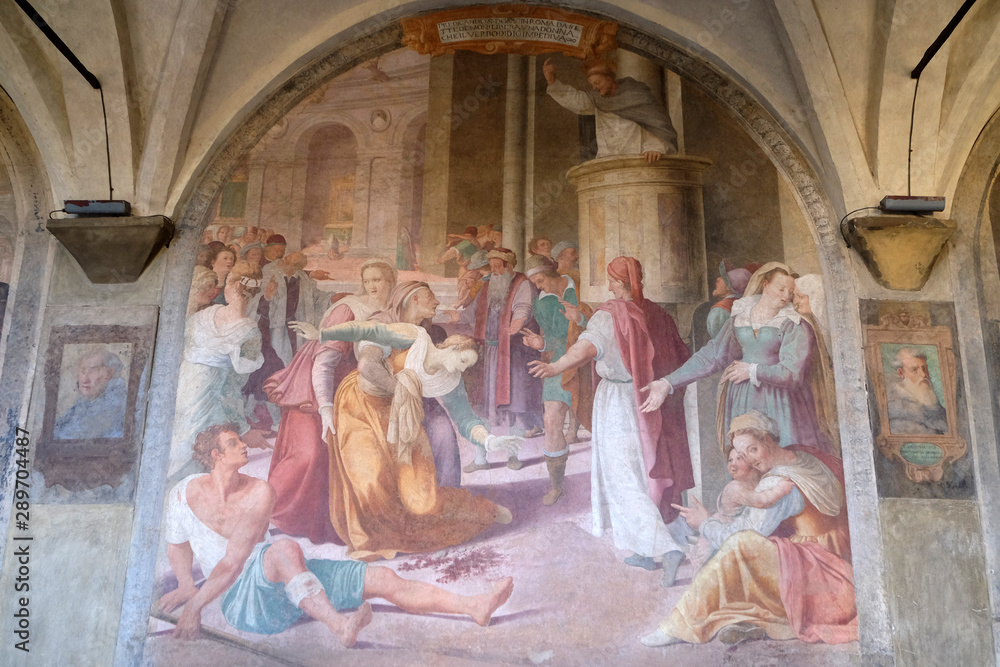 San Dominic frees an obsessed from the Demon, fresco by Lorenzo Sciorina in the cloister of Santa Maria Novella Principal Dominican church in Florence, Italy