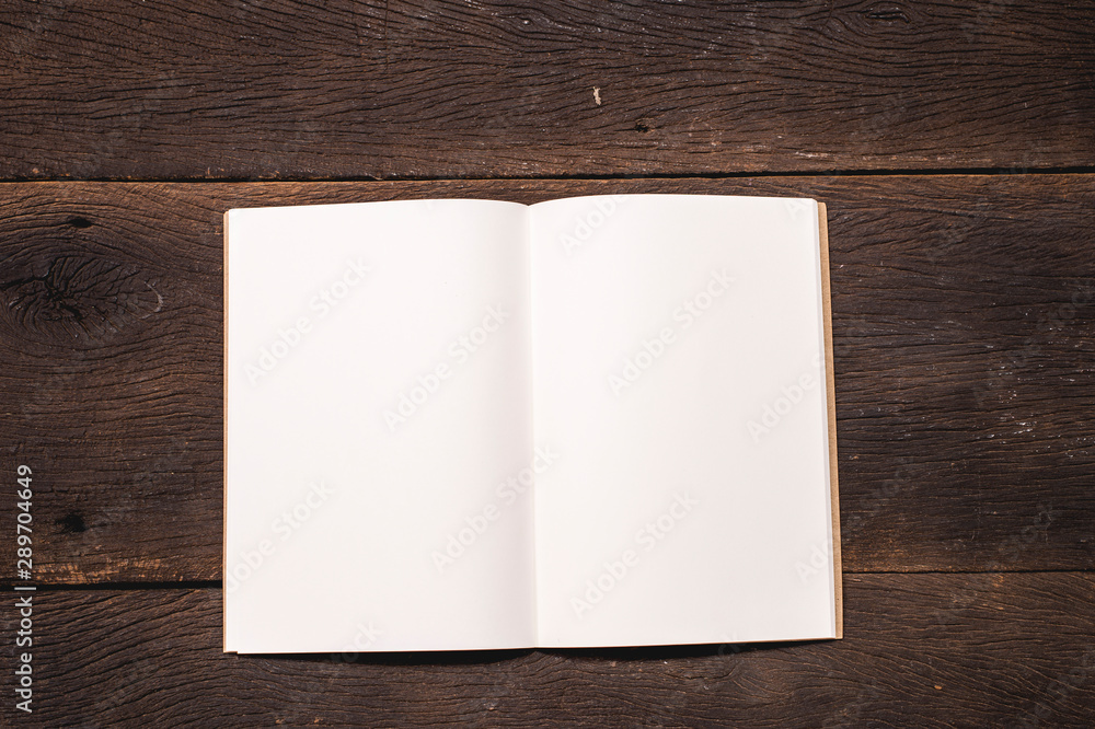 Top view blank notebook on grunge office table 