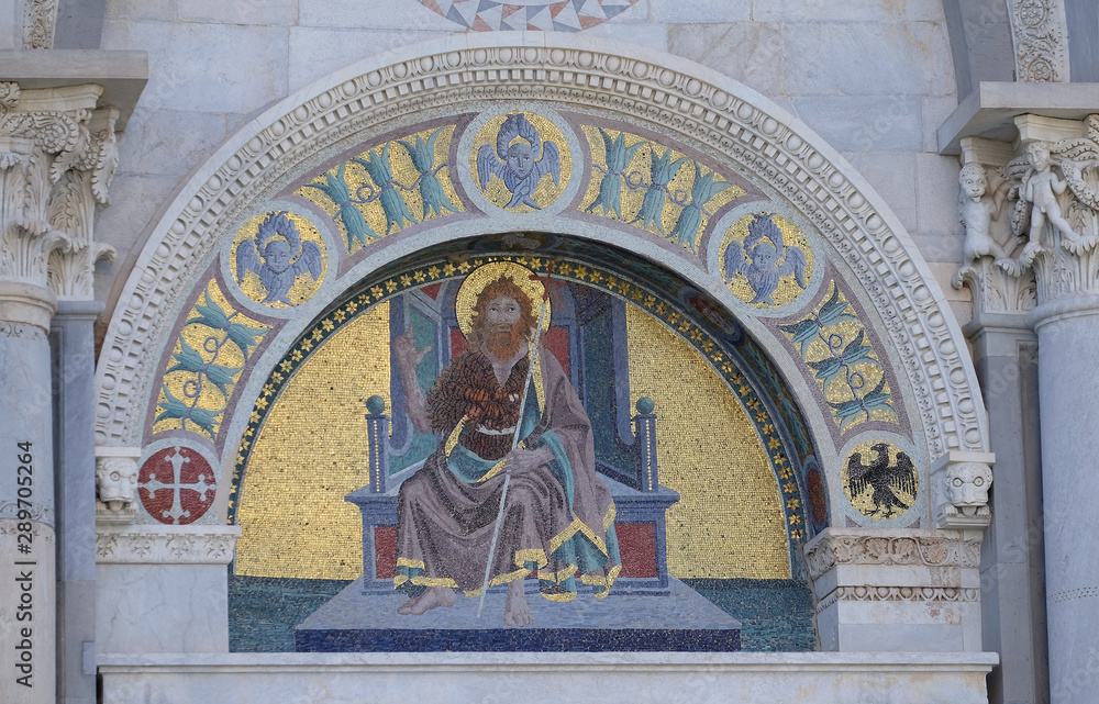 Colourful mosaic by Giuseppe Modena da Lucca, of the John the Baptist, lunette above right door of Cathedral in Pisa, Italy