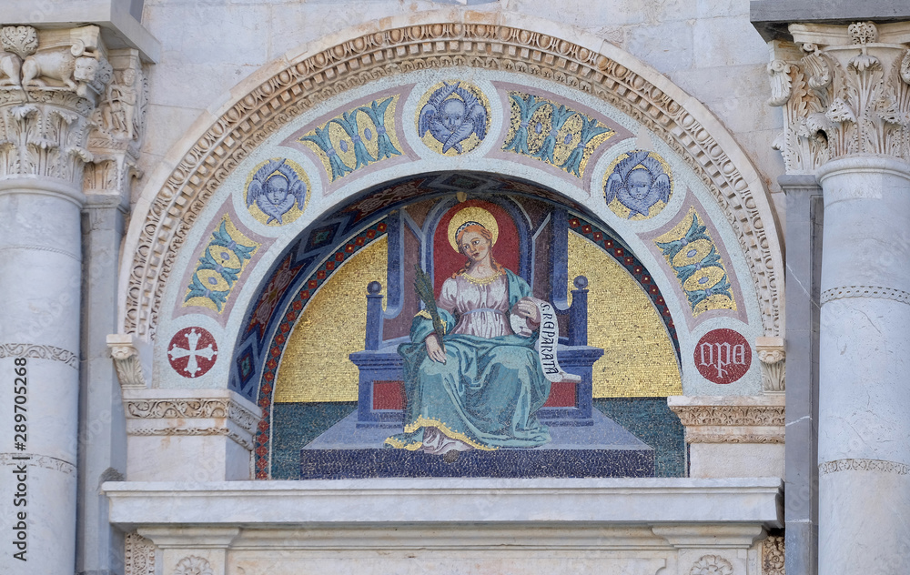 Colourful mosaic by Giuseppe Modena da Lucca, of the Saint Reparata, lunette above left door of Cathedral in Pisa, Italy