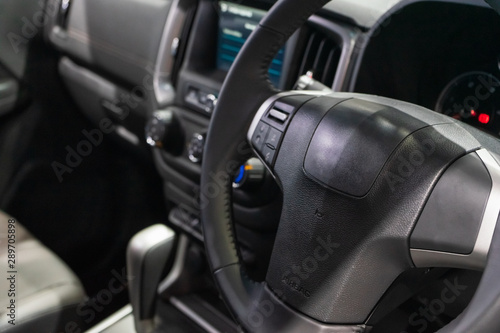 Interior view of modern car, Closeup of car steering wheel.