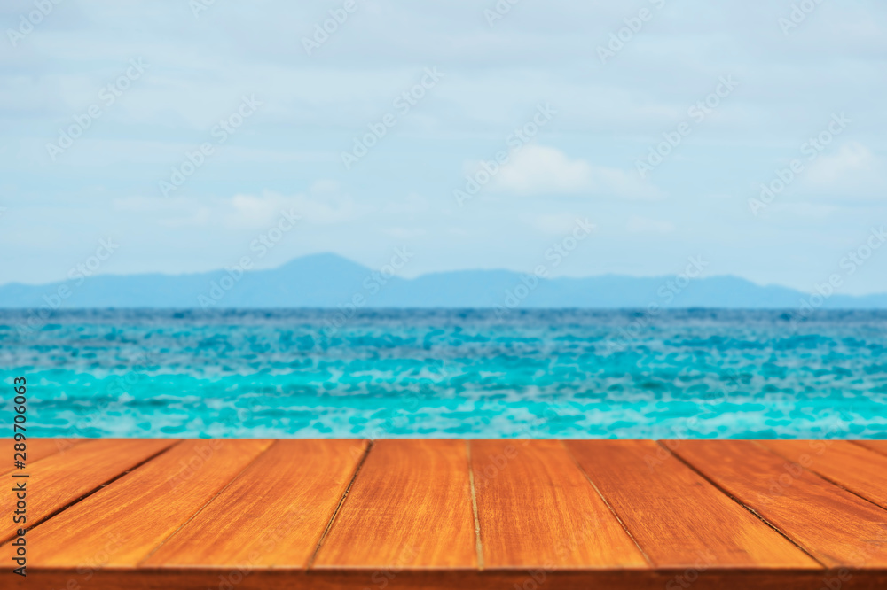 Fototapeta premium Wood table top on tropical ocean background