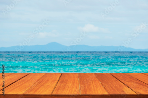 Wood table top on tropical ocean background