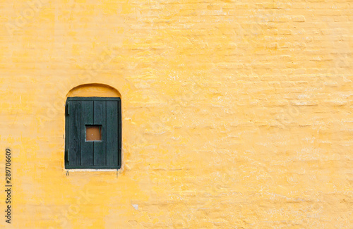 Yellow brick wall of an old house in Arhus, Denmark